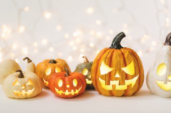 Halloween pumpkins on a shiny light background