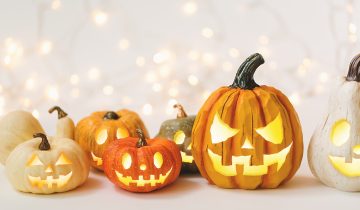 Halloween pumpkins on a shiny light background