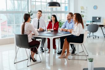 Human resources commission interviewing woman in office